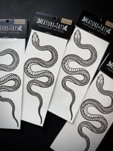 Nature-Tats temporary tattoos with snake design on a black surface