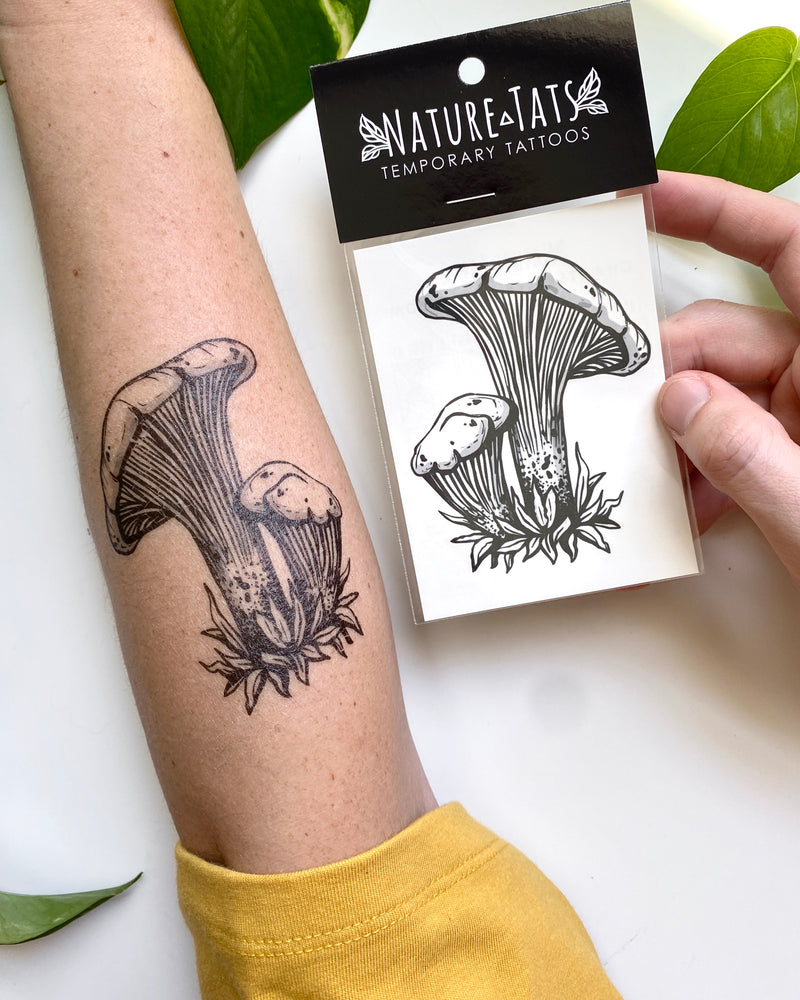 mushroom Temporary tattoo in packaging and on arm with a white background 