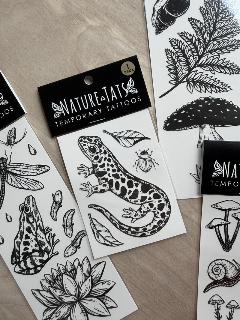 NatureTats temporary tattoos with black and white hand-drawn tattoo designs.
