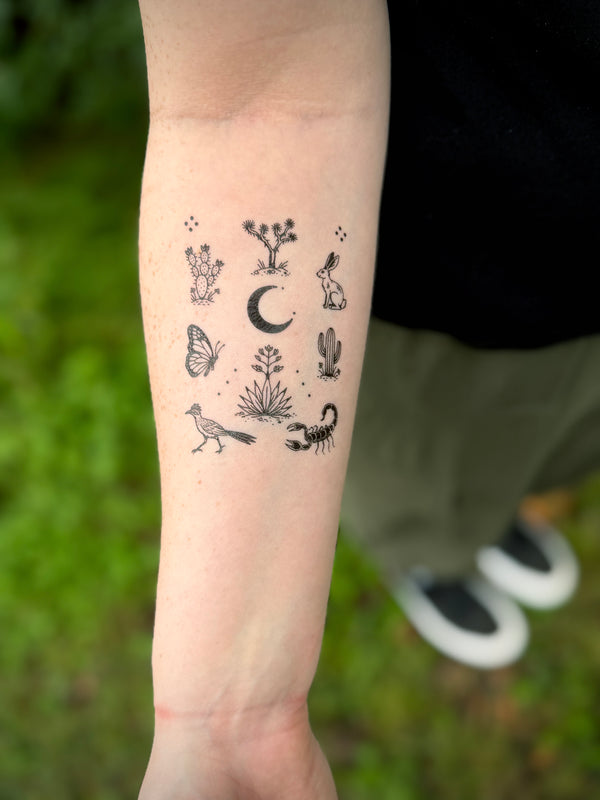 Arm with southwestern style tiny tattoos, desert plants and animals