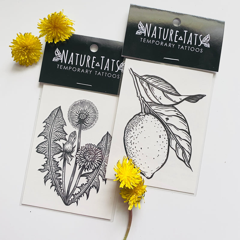 lemon with leaves and dandelion temporary tattoos in packaging with a white background 