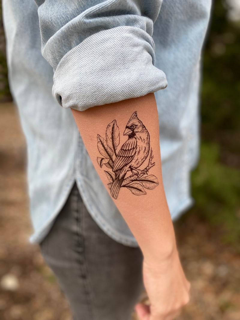 Cardinal Temporary tattoo on arm with denim background 