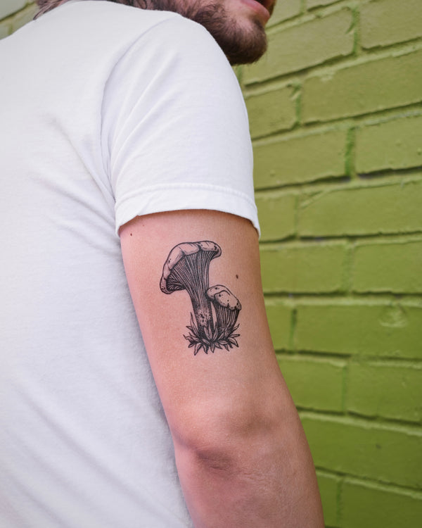 mushroom Temporary tattoo on arm with a green brick background 
