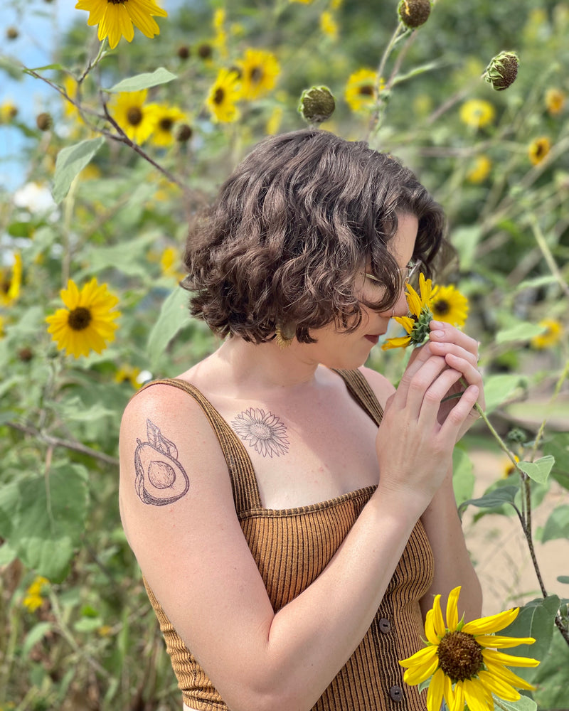 temporary tattoos on a person in a nature background 