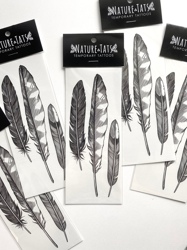 temporary tattoos of the feather finds design in packaging with a white background 