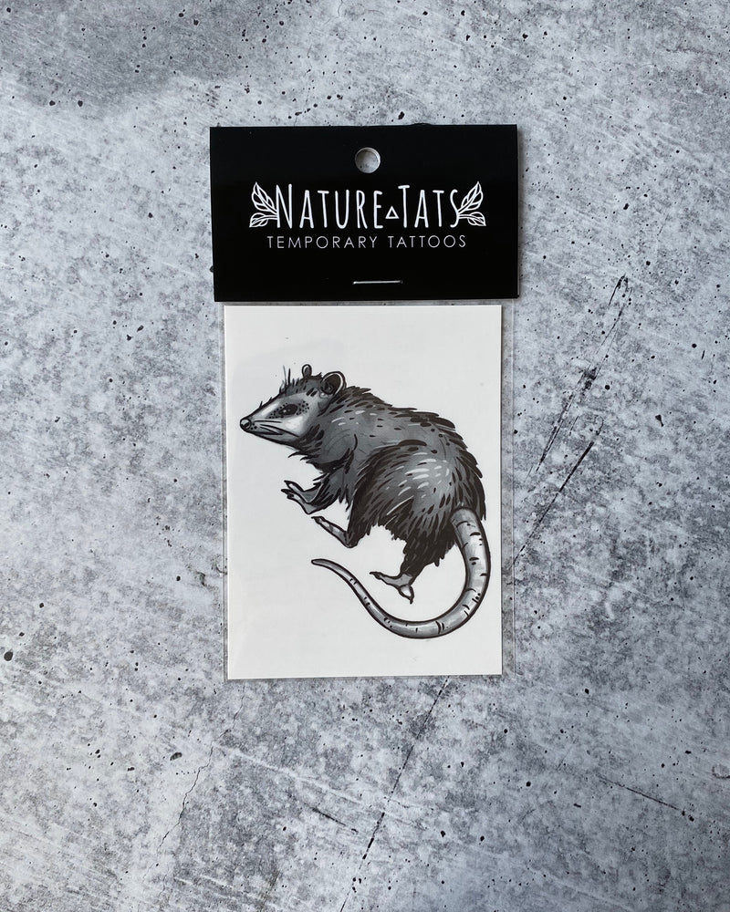 opossum temporary tattoo in packaging on a grey background 