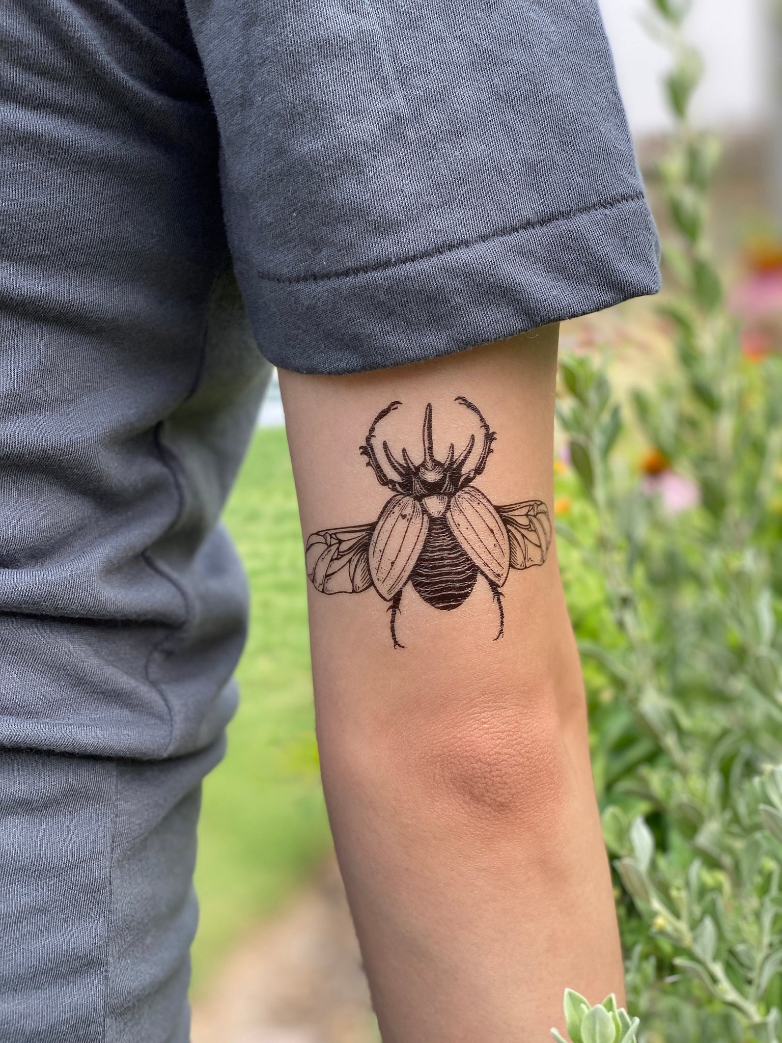 Stunning Blackwork Rhino Beetle Tattoo